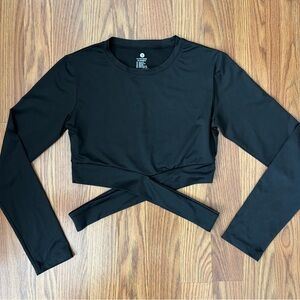 NVGTN cropped workout top with cross detailing at waist